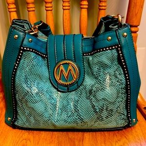 Turquoise purse, snakeskin accents with rhinestone trim.